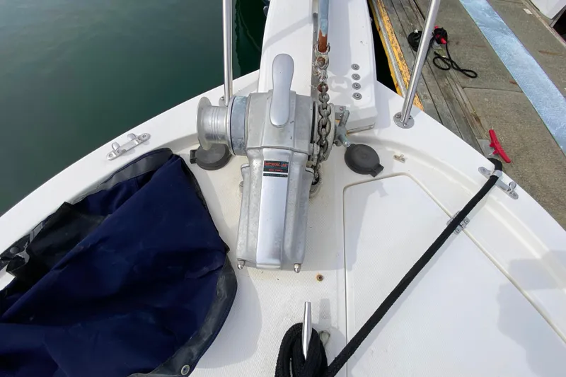 Slide: The Image of 1989 Bayliner 3288 Motoryacht anchor winch on deck, docked at marina. - 43