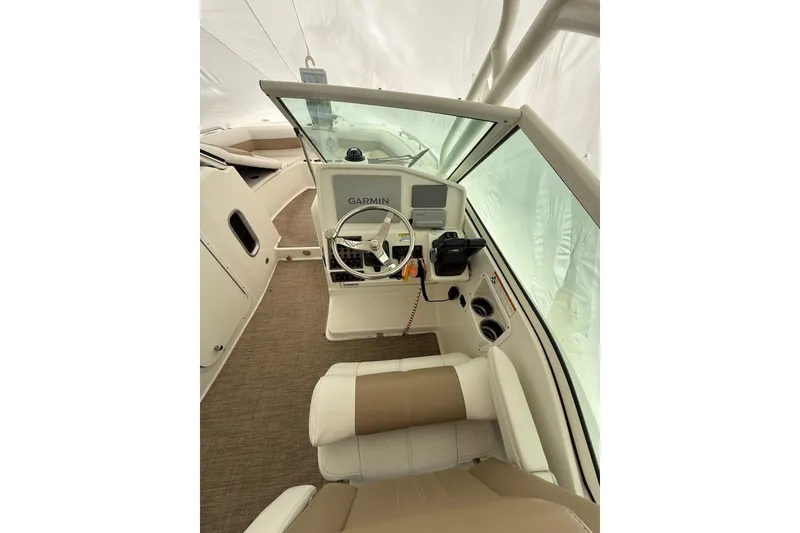Slide: The Image of 2019 World Cat Glacier Bay Edition 2740 Dual Console interior with Garmin navigation system. - 2