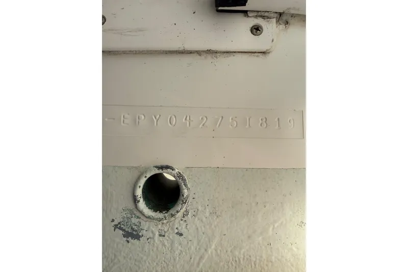 Slide: The Image of 2019 World Cat Glacier Bay Edition 2740 hull identification number and drain hole. - 20