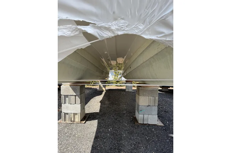 Slide: The Image of 2019 World Cat Glacier Bay Edition 2740 Dual Console boat hull on cinder blocks. - 23