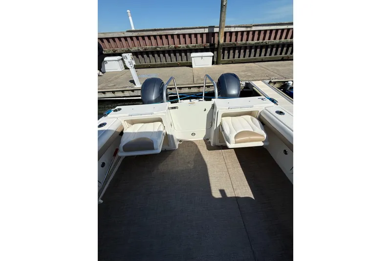 Slide: The Image of 2019 World Cat Glacier Bay Edition 2740 Dual Console boat interior at dock. - 29