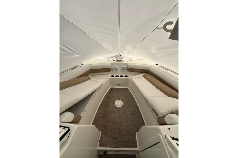 Slide: The Image of 2019 World Cat Glacier Bay Edition 2740 Dual Console interior with cushioned seating. - 3