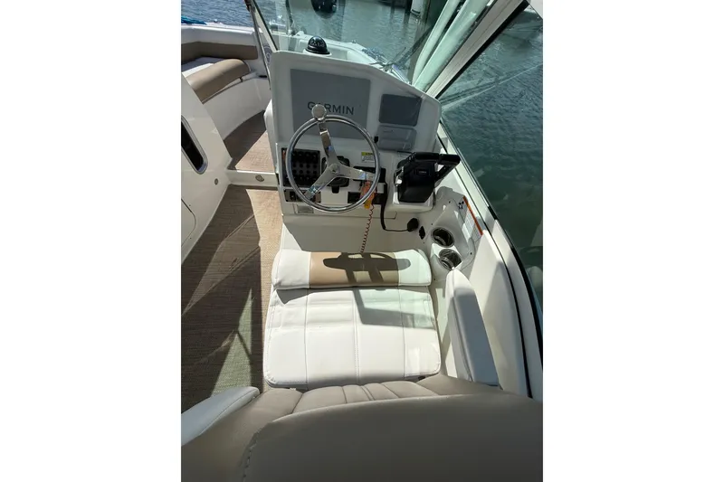 Slide: The Image of 2019 World Cat Glacier Bay Edition 2740 Dual Console helm with steering wheel and controls. - 34