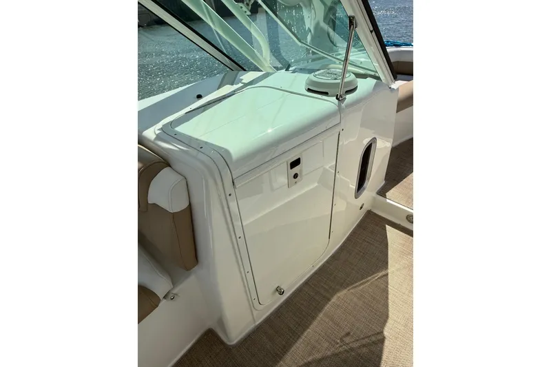 Slide: The Image of 2019 World Cat Glacier Bay Edition 2740 Dual Console interior detail, featuring sleek design and seating. - 49