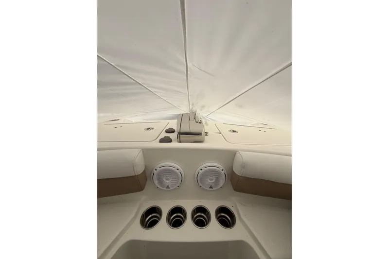 Slide: The Image of 2019 World Cat Glacier Bay Edition 2740 Dual Console interior with speakers and cup holders. - 5