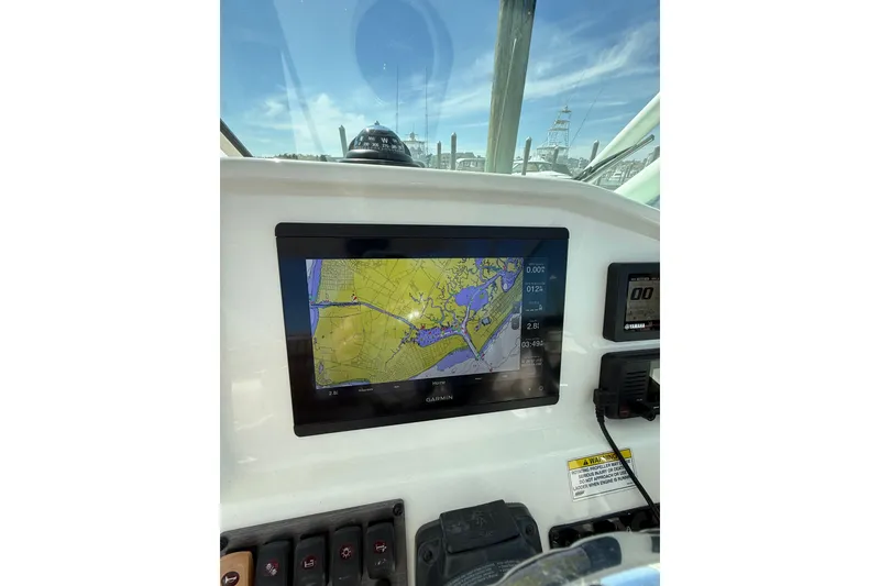 Slide: The Image of 2019 World Cat Glacier Bay Edition 2740 dashboard with Garmin navigation display. - 54