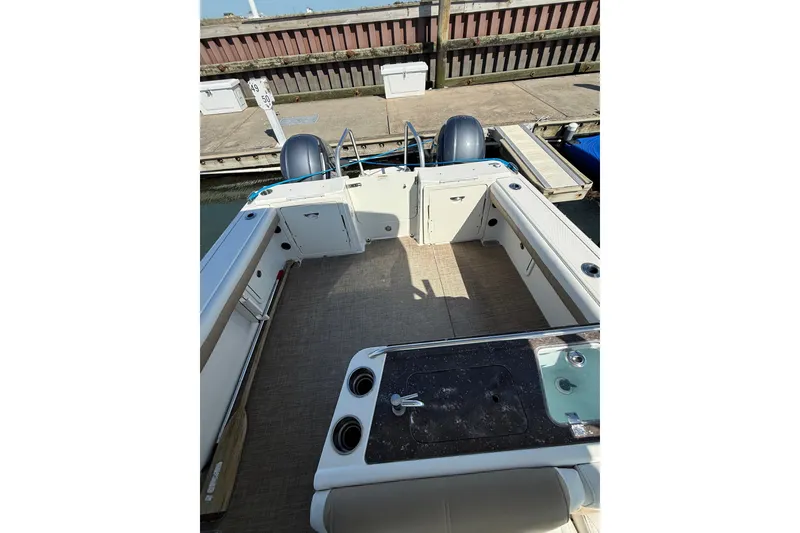 Slide: The Image of 2019 World Cat Glacier Bay Edition 2740 Dual Console boat interior at dock. - 57