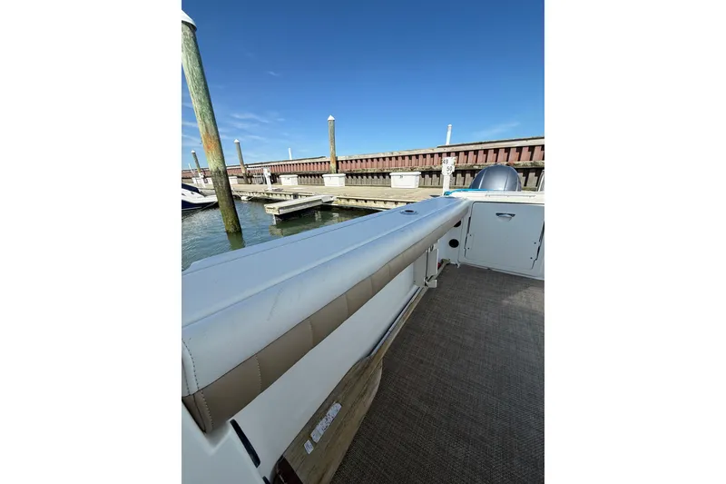 Slide: The Image of 2019 World Cat Glacier Bay Edition 2740 Dual Console at marina dock. - 58