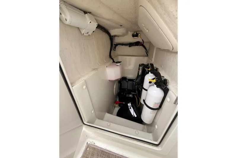 Slide: The Image of 2019 World Cat Glacier Bay Edition 2740 Dual Console storage compartment with safety equipment. - 6