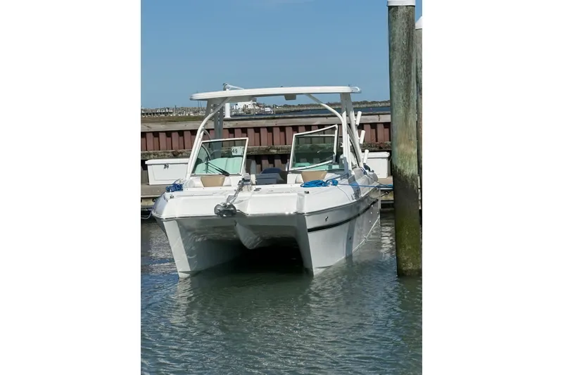 Slide: The Image of 2019 World Cat Glacier Bay Edition 2740 Dual Console boat docked at marina. - 63