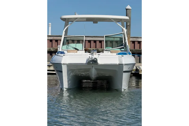 Slide: The Image of 2019 World Cat Glacier Bay Edition 2740 Dual Console boat docked in marina. - 64