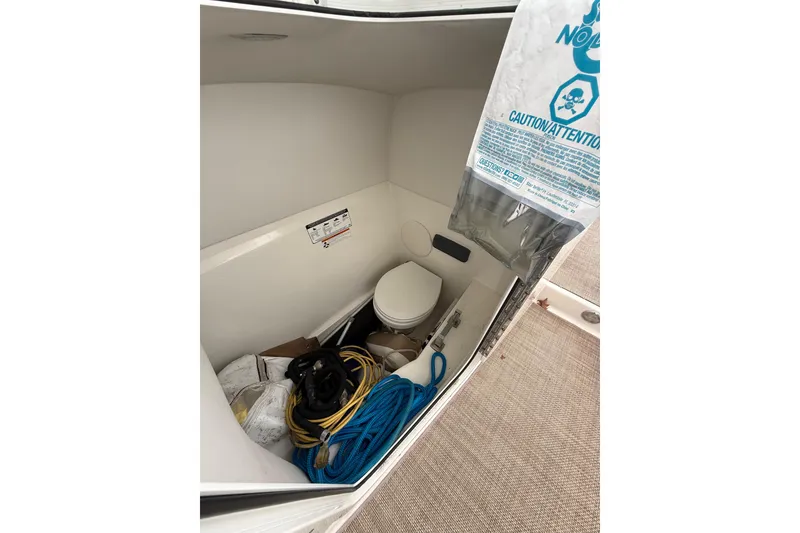 Slide: The Image of Interior of 2019 World Cat Glacier Bay Edition 2740, featuring storage and marine toilet. - 8