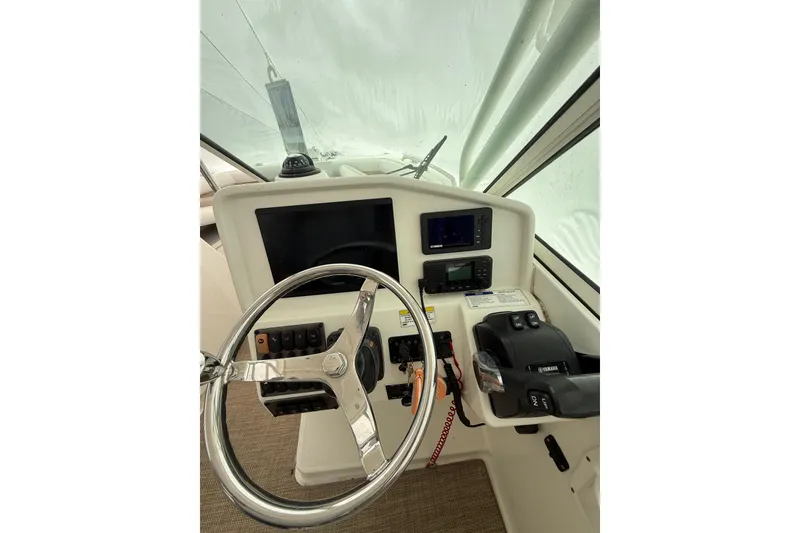 Slide: The Image of Steering console of 2019 World Cat Glacier Bay Edition 2740 Dual Console boat. - 9