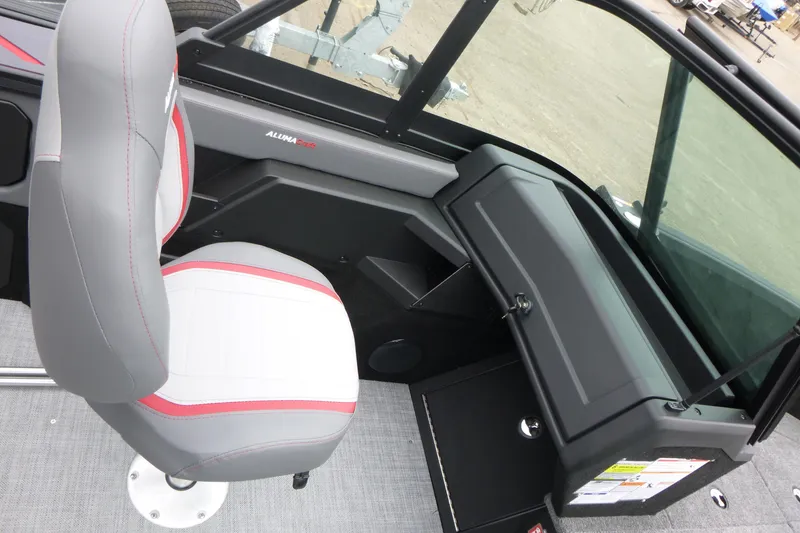 Slide: The Image of 2025 Alumacraft Trophy 185X Sport interior with gray and red seating. - 10