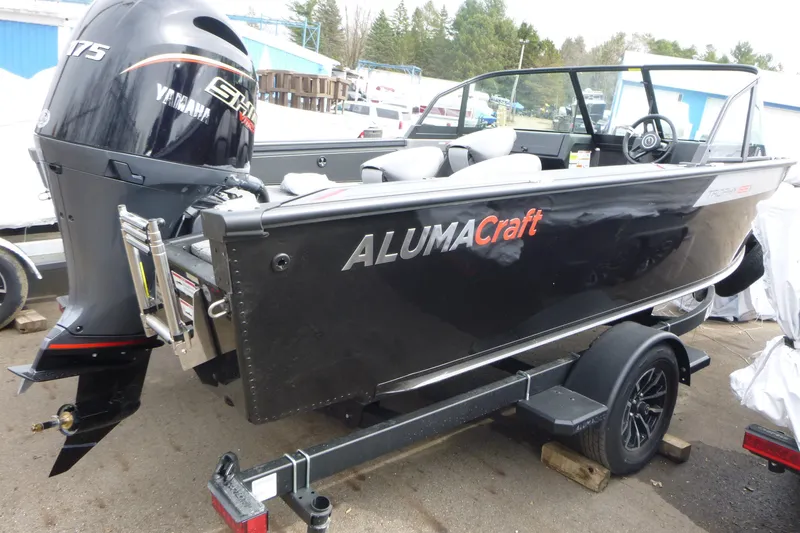 Slide: The Image of 2025 Alumacraft Trophy 185X Sport boat with Yamaha engine on trailer. - 3