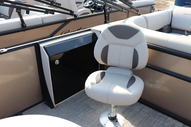 Slide: The Image of 2026 Bentley Pontoons Fish 220 4-Point interior with swivel chair and seating area. - 6