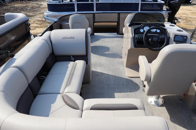 Slide: The Image of 2026 Bentley Pontoons Fish 220 4-Point interior with plush seating and modern dashboard. - 9