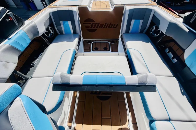 Slide: The Image of Interior of a 2021 Malibu Wakesetter 23 MXZ boat with blue and gray seating. - 11