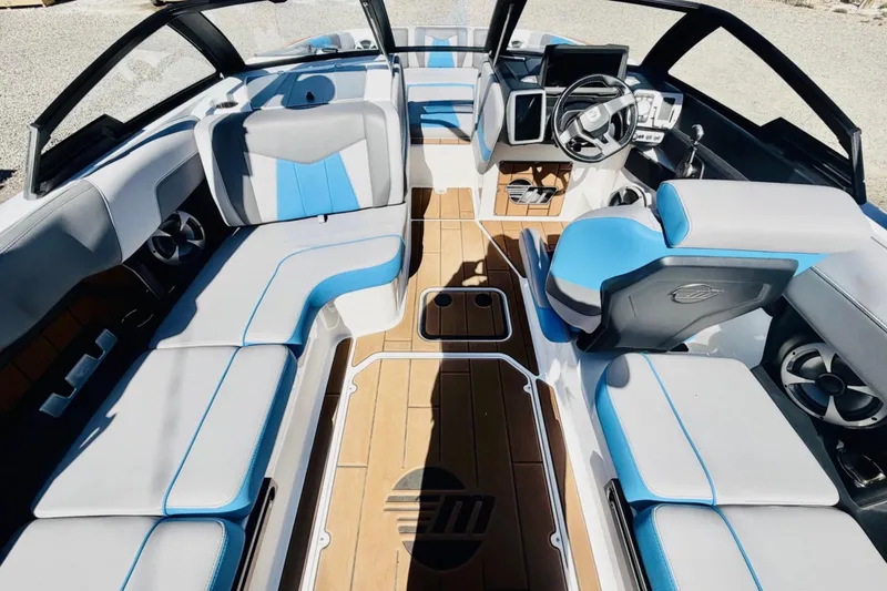 Slide: The Image of 2021 Malibu Wakesetter 23 MXZ interior with sleek seating and modern dashboard design. - 12