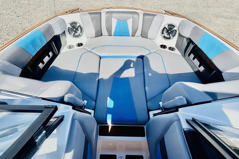 Slide: The Image of Interior of 2021 Malibu Wakesetter 23 MXZ boat with blue and gray seating. - 18