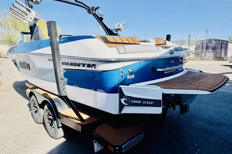 Slide: The Image of 2021 Malibu Wakesetter 23 MXZ boat on trailer, featuring Surf Gate technology. - 3