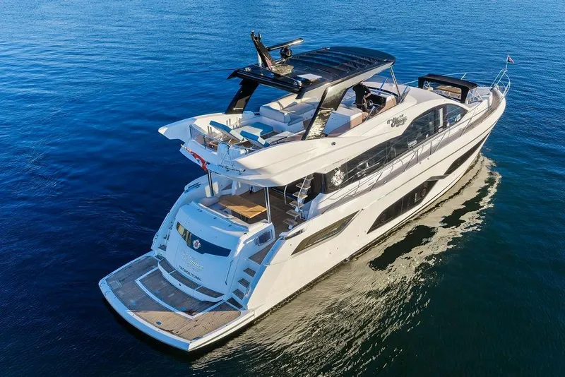 Slide: The Image of Luxurious 2021 Sunseeker Manhattan 68 yacht cruising on serene blue waters. - 10