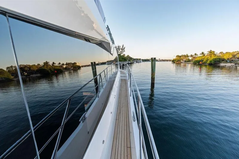 Slide: The Image of Sunseeker Manhattan 68 yacht cruising on calm waters, 2021 model. - 21