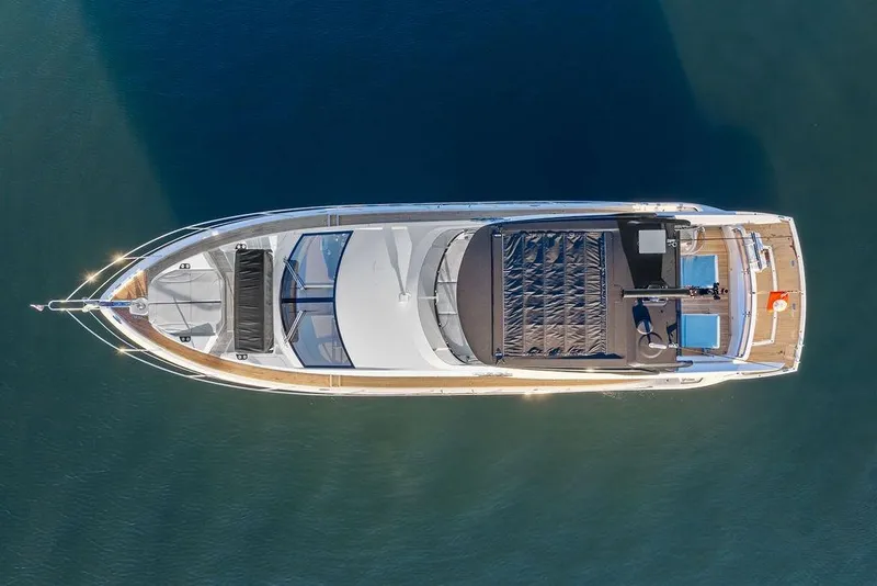 Slide: The Image of Aerial view of 2021 Sunseeker Manhattan 68 yacht on calm water. - 27