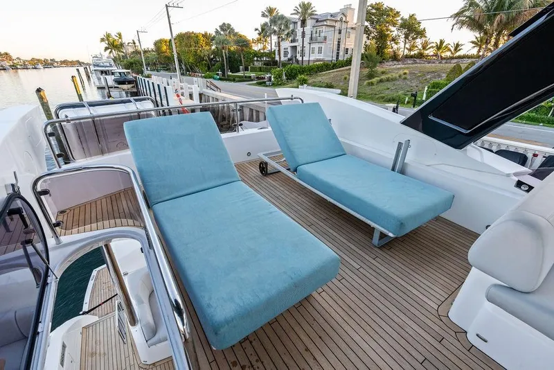 Slide: The Image of Sunseeker Manhattan 68 yacht deck with blue loungers, 2021 model. - 28