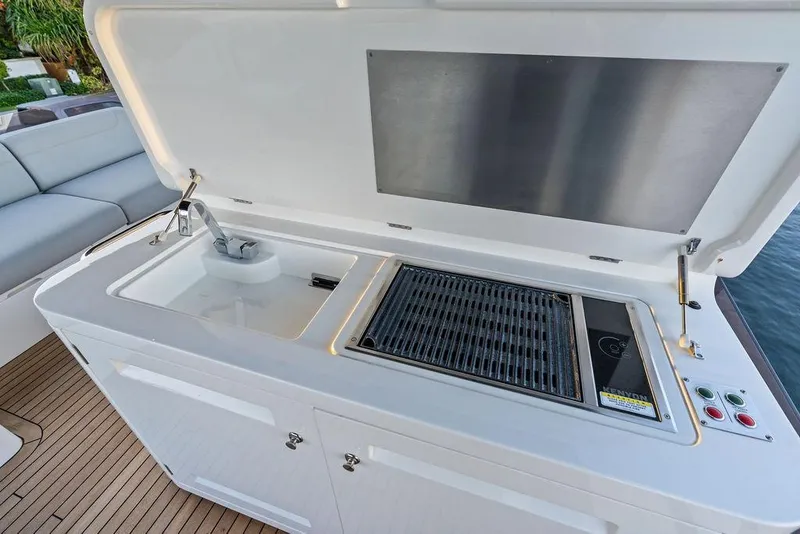 Slide: The Image of Outdoor kitchen on 2021 Sunseeker Manhattan 68 yacht with sink and grill. - 33