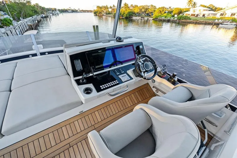 Slide: The Image of Luxurious helm of 2021 Sunseeker Manhattan 68 yacht with scenic waterfront view. - 35