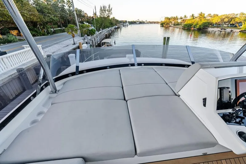 Slide: The Image of Sunseeker Manhattan 68 yacht's spacious deck with waterfront view, 2021 model. - 37