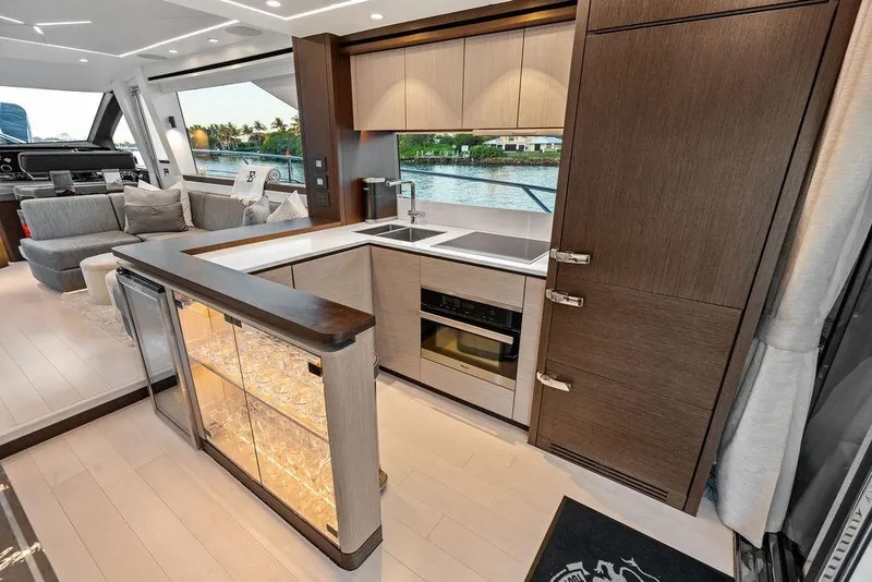 Slide: The Image of Luxurious interior of 2021 Sunseeker Manhattan 68 yacht with modern kitchen and seating area. - 42