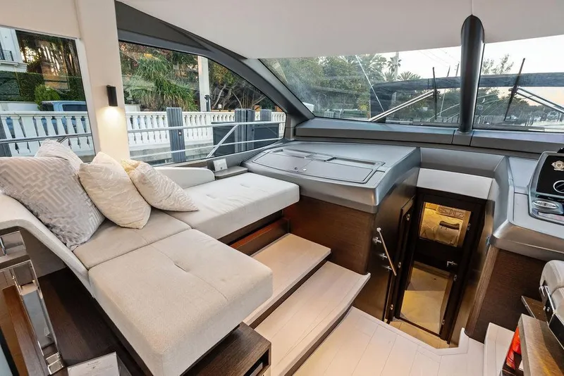 Slide: The Image of Luxurious interior of 2021 Sunseeker Manhattan 68 yacht with modern seating and large windows. - 46