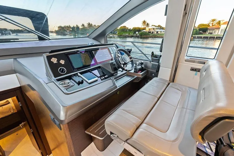 Slide: The Image of Luxurious helm of 2021 Sunseeker Manhattan 68 yacht with modern navigation controls. - 47