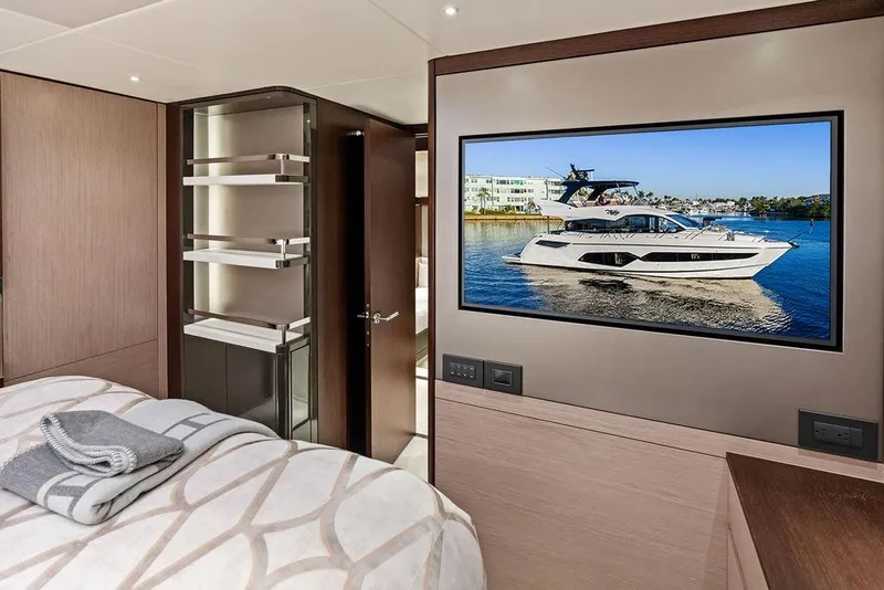 Slide: The Image of Luxurious Sunseeker Manhattan 68 yacht interior with modern bedroom and TV display, 2021 model. - 52