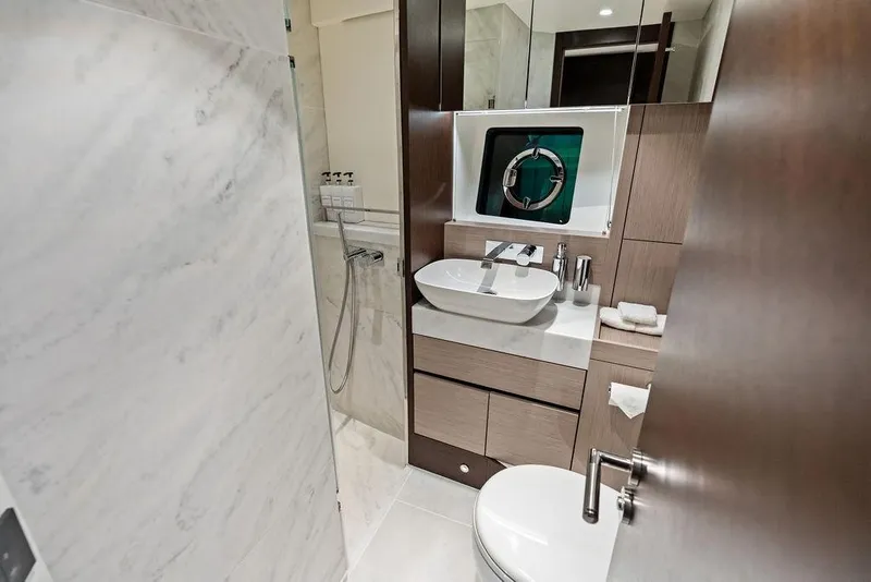 Slide: The Image of Luxurious bathroom in 2021 Sunseeker Manhattan 68 yacht with modern fixtures and marble accents. - 53