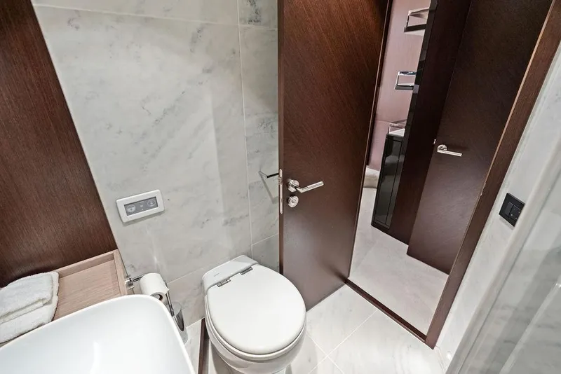 Slide: The Image of Luxurious bathroom interior on 2021 Sunseeker Manhattan 68 yacht, featuring modern fixtures and marble walls. - 55