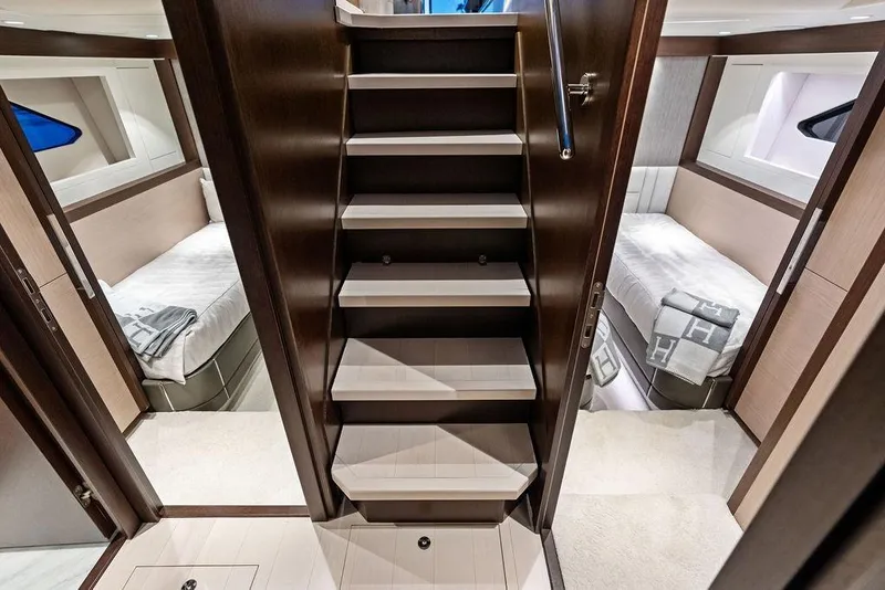 Slide: The Image of Luxurious interior of 2021 Sunseeker Manhattan 68 yacht with elegant twin cabins and staircase. - 56