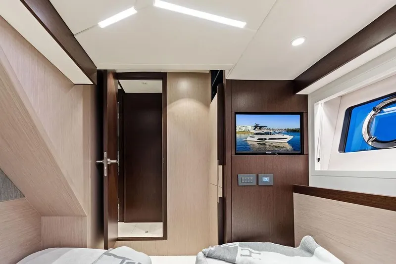 Slide: The Image of Interior of 2021 Sunseeker Manhattan 68 yacht cabin with modern design and window view. - 58