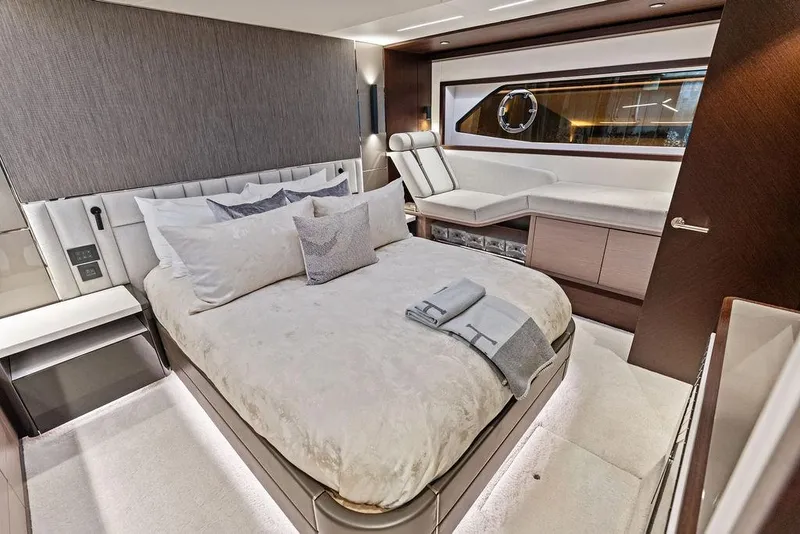 Slide: The Image of Luxurious bedroom interior of 2021 Sunseeker Manhattan 68 yacht, featuring elegant bedding and modern design. - 63