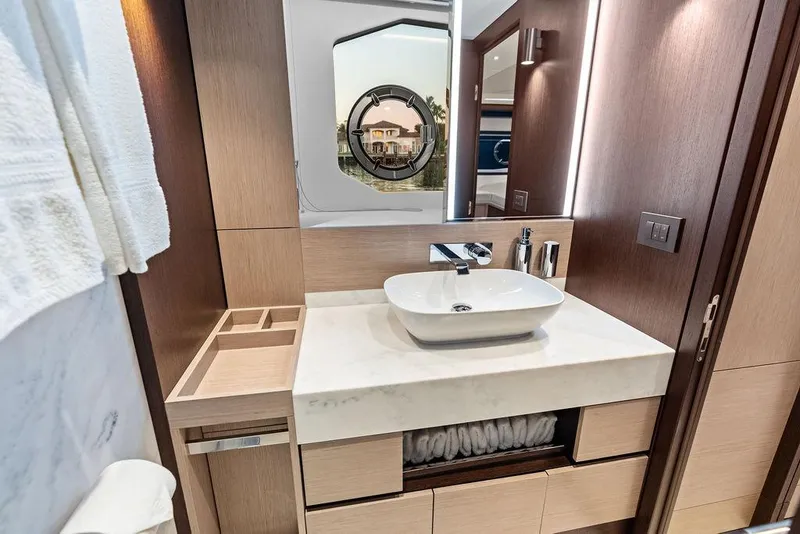 Slide: The Image of Luxurious bathroom interior of 2021 Sunseeker Manhattan 68 yacht with modern sink and mirror. - 68