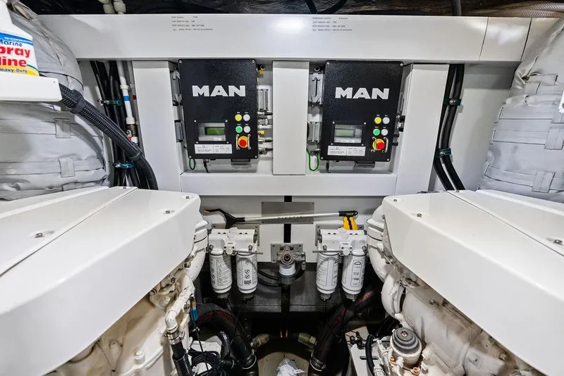 Slide: The Image of Engine room of 2021 Sunseeker Manhattan 68 yacht with MAN engines and control systems. - 76