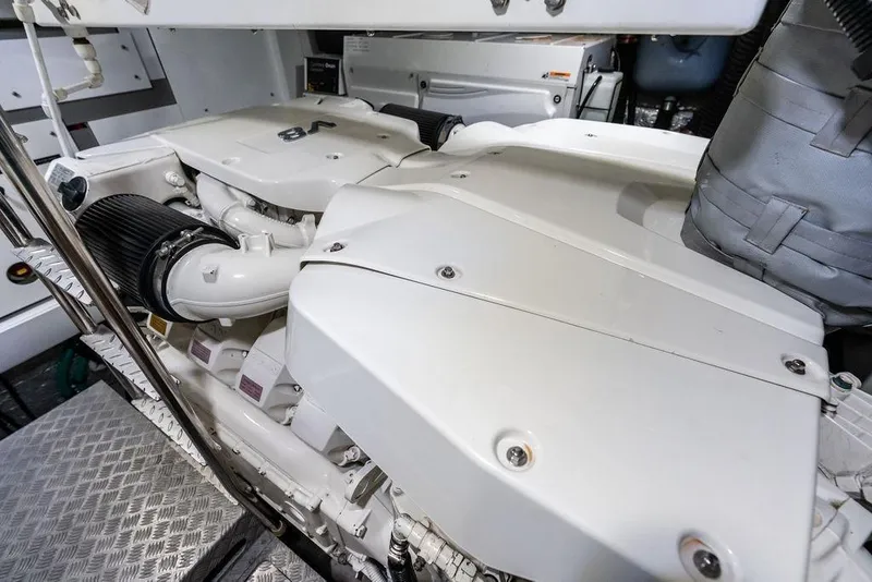 Slide: The Image of Engine room of 2021 Sunseeker Manhattan 68 yacht, showcasing powerful machinery and components. - 77