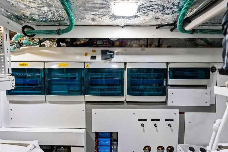 Slide: The Image of Electrical control panel in a 2021 Sunseeker Manhattan 68 yacht engine room. - 79