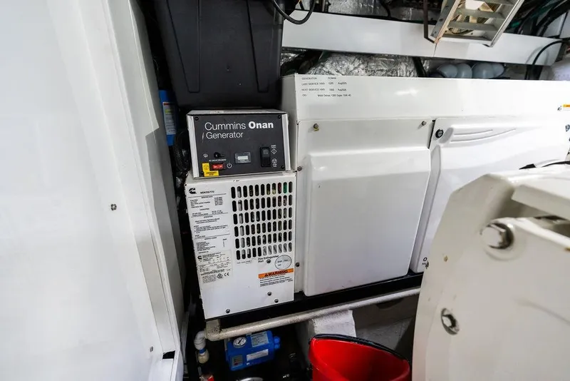 Slide: The Image of Engine room of 2021 Sunseeker Manhattan 68 with Cummins Onan generator. - 80