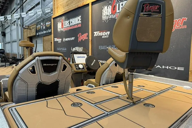 Slide: The Image of Interior of 2026 Ranger Z520R Ultra boat with tan seating and control panel. - 11