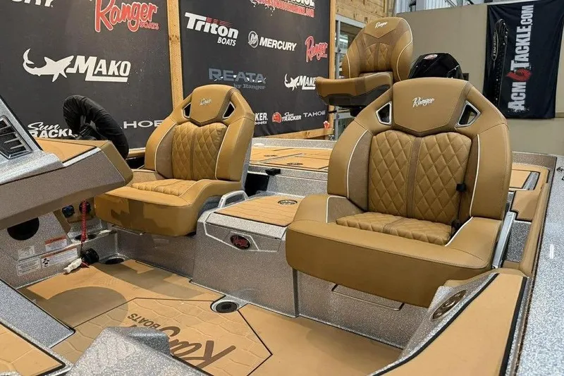 Slide: The Image of 2026 Ranger Z520R Ultra boat interior with luxurious tan seating and modern dashboard. - 17