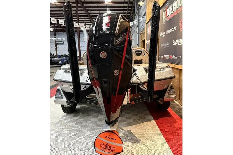 Slide: The Image of 2026 Ranger Z520R Ultra boat displayed indoors with powerful engine and sleek design. - 3