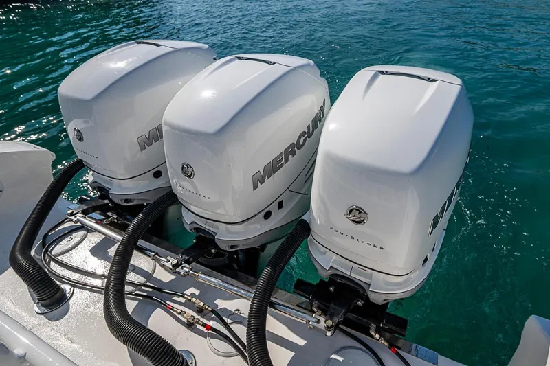 Slide: The Image of Triple Mercury outboard engines on a 2020 Fountain 38 Center Console boat. - 11